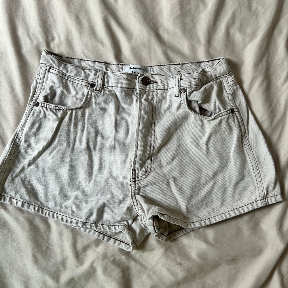 Reformation white jean shorts with brown seams
